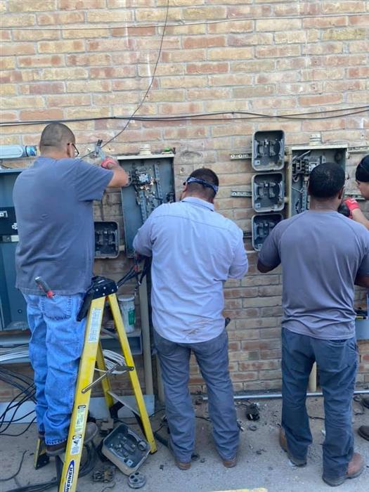 Tovar Electric crew replacing outside electrical panels